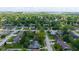 Picturesque aerial view of a quiet residential neighborhood, featuring lush green trees and well-maintained homes at 1416 Miami S Ct, Plainfield, IN 46168