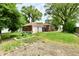 Large backyard with a detached garage and garden area at 1440 Brandt Dr, Indianapolis, IN 46241