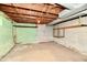 Unfinished basement with exposed ceiling and cinderblock walls at 1440 Brandt Dr, Indianapolis, IN 46241
