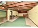 Unfinished basement with a wood burning stove and exposed ceiling beams at 1440 Brandt Dr, Indianapolis, IN 46241