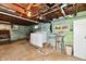 Unfinished basement laundry area with washer, dryer and utility sink at 1440 Brandt Dr, Indianapolis, IN 46241