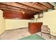 Unfinished basement with exposed ceiling, cinderblock walls and painted floor at 1440 Brandt Dr, Indianapolis, IN 46241