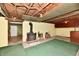 Unfinished basement featuring a wood burning stove and exposed ceiling at 1440 Brandt Dr, Indianapolis, IN 46241