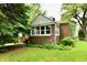 Charming brick home with a well-maintained lawn and lush greenery at 1440 Brandt Dr, Indianapolis, IN 46241