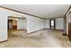 Living room featuring a transition archway into the kitchen and carpeted floors at 1440 Brandt Dr, Indianapolis, IN 46241
