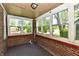 Bright sunroom with brick walls and multiple windows at 1440 Brandt Dr, Indianapolis, IN 46241