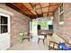 Inviting sunroom featuring brick walls and comfortable seating at 1440 Brandt Dr, Indianapolis, IN 46241