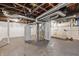 Unfinished basement with exposed utilities offers plenty of storage space at 1521 N Gladstone Ave, Indianapolis, IN 46201