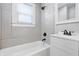 Stylish bathroom features a tub, shower, modern vanity and tiled walls at 1521 N Gladstone Ave, Indianapolis, IN 46201