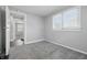 A bedroom features gray walls, bright windows, and an open doorway at 1521 N Gladstone Ave, Indianapolis, IN 46201