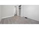 This bedroom has neutral carpeting, light-gray walls and an open closet at 1521 N Gladstone Ave, Indianapolis, IN 46201
