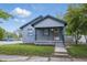 Charming single-story home with blue siding and a welcoming front porch at 1521 N Gladstone Ave, Indianapolis, IN 46201