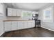 Updated kitchen featuring white cabinets, butcher block countertops, and stainless steel appliances at 1521 N Gladstone Ave, Indianapolis, IN 46201