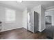 Bright kitchen features stainless steel refrigerator and wood-look flooring at 1521 N Gladstone Ave, Indianapolis, IN 46201