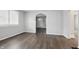 Bright living room area featuring an archway and modern flooring throughout at 1521 N Gladstone Ave, Indianapolis, IN 46201