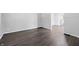 Light and airy living room with new flooring and crisp trim accents at 1521 N Gladstone Ave, Indianapolis, IN 46201