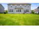 Spacious backyard with lush green lawn and multi-story house presents an inviting outdoor space for relaxation and entertainment at 15580 Garrano Ln, Fishers, IN 46040