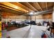 Large unfinished basement with exposed wood beams, concrete floor, and open layout offers lots of potential at 15580 Garrano Ln, Fishers, IN 46040