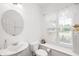 Small bathroom featuring a pedestal sink, toilet, and a window with white blinds at 15580 Garrano Ln, Fishers, IN 46040