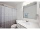 Bathroom featuring a vanity with white cabinets, a toilet, and a shower with a curtain at 15580 Garrano Ln, Fishers, IN 46040