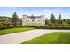 Stone and brick entrance to The Sanctuary at Steeplechase welcomes residents with its well-maintained landscaping at 15580 Garrano Ln, Fishers, IN 46040