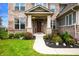 Attractive front entrance with colorful flowers and a well-maintained walkway at 15580 Garrano Ln, Fishers, IN 46040