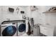 Well-organized laundry room with modern appliances, wire shelving, and ample storage space for convenience at 15580 Garrano Ln, Fishers, IN 46040