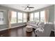 Cozy living room with a large window providing natural light and a comfortable seating arrangement at 15580 Garrano Ln, Fishers, IN 46040