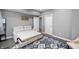 Living room with a pull-out sofa bed and a blue patterned rug at 15580 Garrano Ln, Fishers, IN 46040