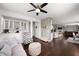 Open-concept living room showcasing seamless flow into kitchen with stylish decor and modern finishes at 15580 Garrano Ln, Fishers, IN 46040