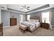 Inviting main bedroom with a plush bed, soft lighting, and elegant furnishings at 15580 Garrano Ln, Fishers, IN 46040