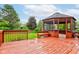 Back deck featuring a charming gazebo overlooking a well-maintained backyard at 1649 Woodstock Dr, Brownsburg, IN 46112