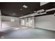Finished basement with support columns, wet bar and recessed lights offers flexible living space at 1649 Woodstock Dr, Brownsburg, IN 46112