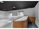 Basement bar featuring a sink, light wood cabinetry and counter space for entertaining and storage at 1649 Woodstock Dr, Brownsburg, IN 46112