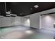 Spacious basement featuring black ceiling, recessed lighting, and neutral walls, ideal for flexible living at 1649 Woodstock Dr, Brownsburg, IN 46112