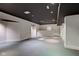 Bright, unfinished basement with recessed lights and wet bar provides ample space for recreation at 1649 Woodstock Dr, Brownsburg, IN 46112