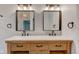 Charming bathroom with dual sink vanity, marble countertop, and rustic wood cabinets at 1649 Woodstock Dr, Brownsburg, IN 46112