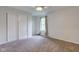 Cozy bedroom with neutral carpet, ceiling fan, sliding closet doors and ample natural light at 1649 Woodstock Dr, Brownsburg, IN 46112