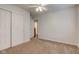 Bedroom featuring ceiling fan, closet, and neutral carpeting at 1649 Woodstock Dr, Brownsburg, IN 46112