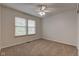 This bedroom features a ceiling fan and natural light at 1649 Woodstock Dr, Brownsburg, IN 46112