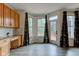 Bright dining area featuring wood floors, lots of windows, and natural light at 1649 Woodstock Dr, Brownsburg, IN 46112