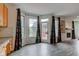 Bright dining area with hardwood floors, lots of windows, and access to outdoor patio at 1649 Woodstock Dr, Brownsburg, IN 46112