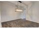 The dining room showcases wainscotting, vinyl floors, and a pendant light at 1649 Woodstock Dr, Brownsburg, IN 46112