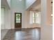 Bright foyer with hardwood floors, soaring ceilings, and an inviting entryway at 1649 Woodstock Dr, Brownsburg, IN 46112