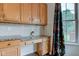 Kitchen featuring wooden cabinets, granite countertops, and tile backsplash at 1649 Woodstock Dr, Brownsburg, IN 46112