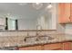 Kitchen view features granite countertops, subway tile backsplash, and stainless sink at 1649 Woodstock Dr, Brownsburg, IN 46112