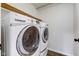 Modern laundry room featuring front loading washer and dryer at 1649 Woodstock Dr, Brownsburg, IN 46112