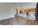 Bright living room featuring hardwood floors, natural light, and open access to the kitchen at 1649 Woodstock Dr, Brownsburg, IN 46112