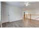 Open living room featuring vinyl floors and a white door at 1649 Woodstock Dr, Brownsburg, IN 46112