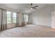 Spacious main bedroom with carpeting and lots of natural light at 1649 Woodstock Dr, Brownsburg, IN 46112
